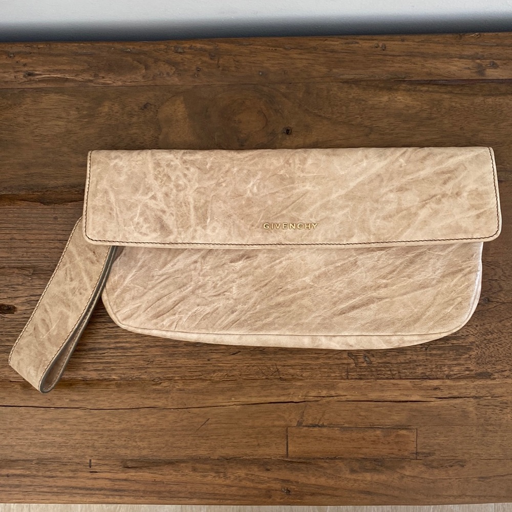 Givenchy beige leather military clutch. Can also be worn as a wristlet.